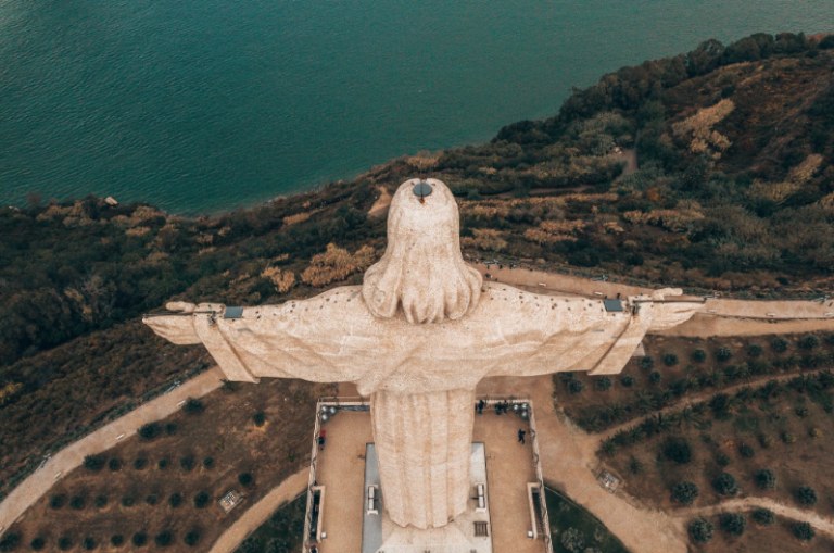 Aerial shot of a giant statue in Portugal